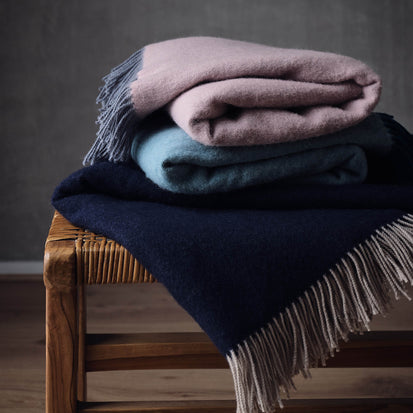 Jonava Merino Wool Blanket in dark blue & natural | Home & Living inspiration | URBANARA